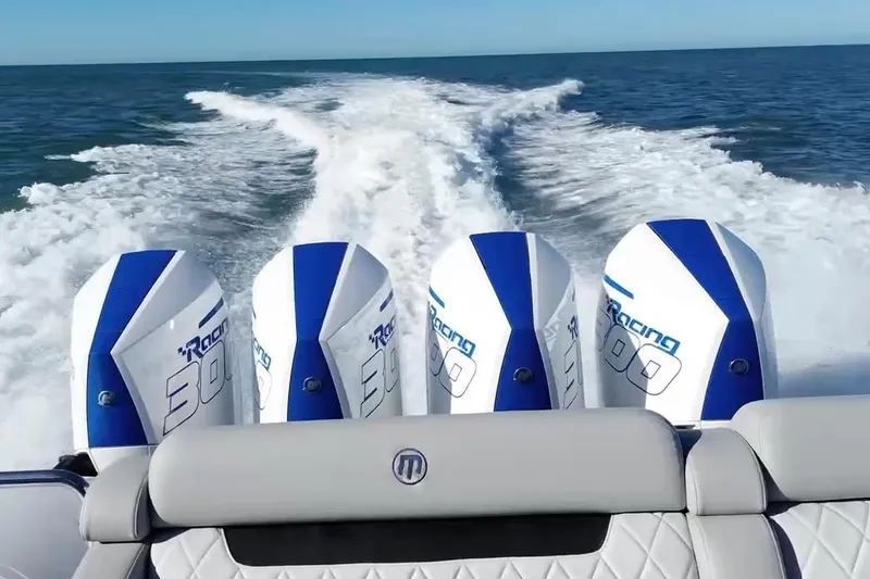 Take It To The Max Yacht Photos Pics 2023 Mystic Powerboats M3800 with four powerful outboard engines on open water.