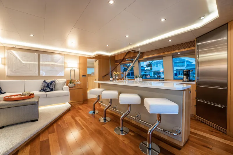 Tranquility Yacht Photos Pics Luxurious interior of 2013 Horizon PC60 yacht with modern kitchen and seating area.