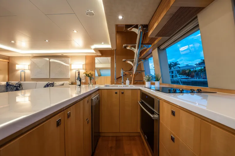 Tranquility Yacht Photos Pics Luxurious kitchen interior on 2013 Horizon PC60 yacht with modern appliances and elegant decor.