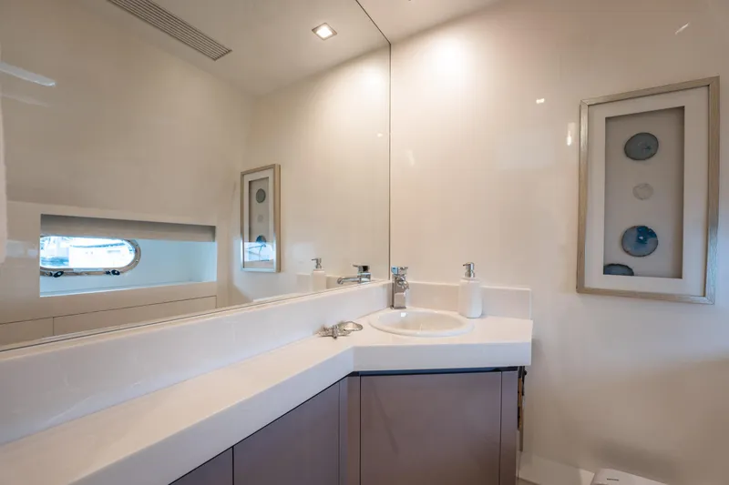 Tranquility Yacht Photos Pics Luxurious bathroom interior on 2013 Horizon PC60 yacht, featuring modern sink and elegant decor.