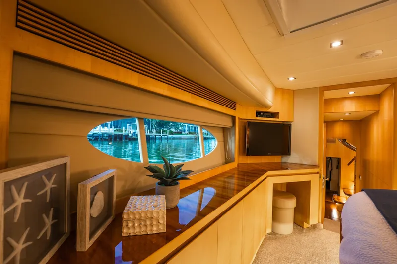 Tranquility Yacht Photos Pics Luxurious interior of 2013 Horizon PC60 yacht with elegant wood finishes and scenic window view.