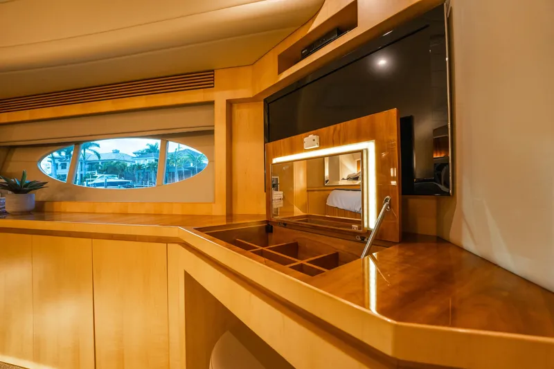 Tranquility Yacht Photos Pics Luxurious interior of 2013 Horizon PC60 yacht with elegant wood finish and modern amenities.