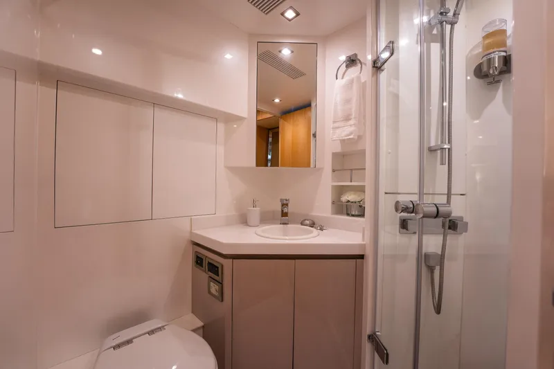 Tranquility Yacht Photos Pics Luxurious bathroom in 2013 Horizon PC60 yacht with modern fixtures and shower.