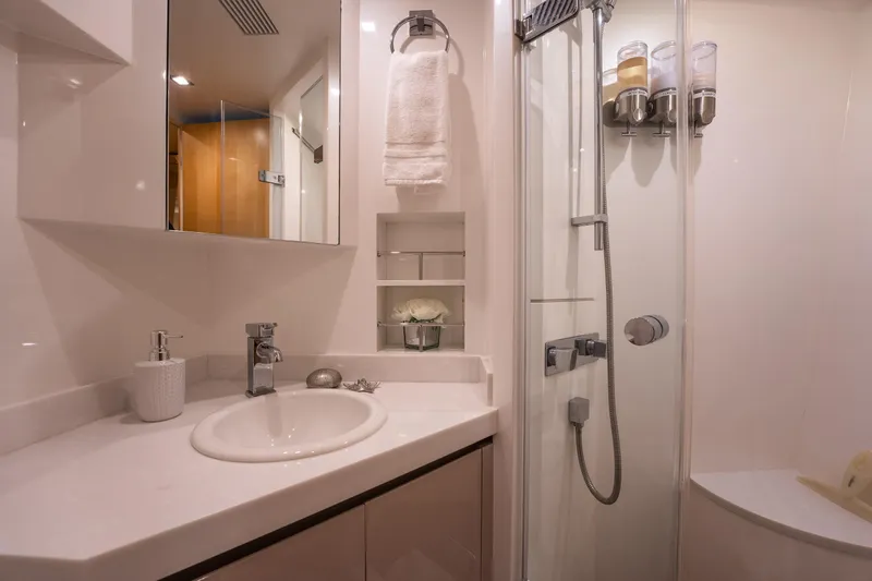 Tranquility Yacht Photos Pics Modern bathroom in 2013 Horizon PC60 yacht with sleek fixtures and glass shower.