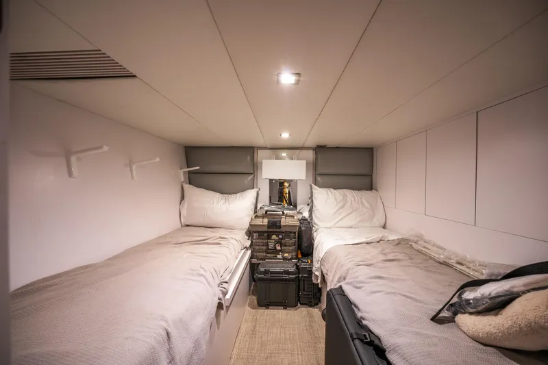 Tranquility Yacht Photos Pics Cozy twin cabin interior of 2013 Horizon PC60 yacht with modern lighting and storage.