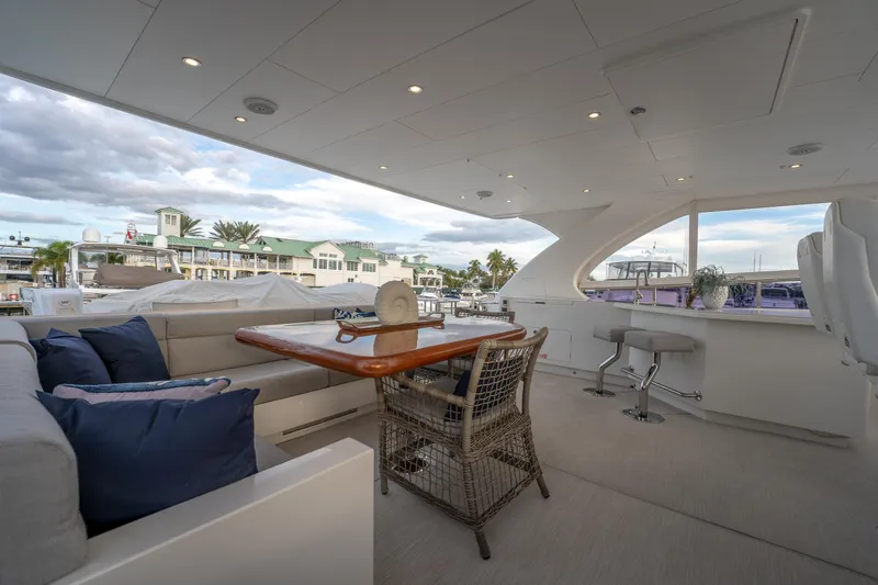 Tranquility Yacht Photos Pics Luxurious 2013 Horizon PC60 yacht interior with elegant seating and scenic marina view.