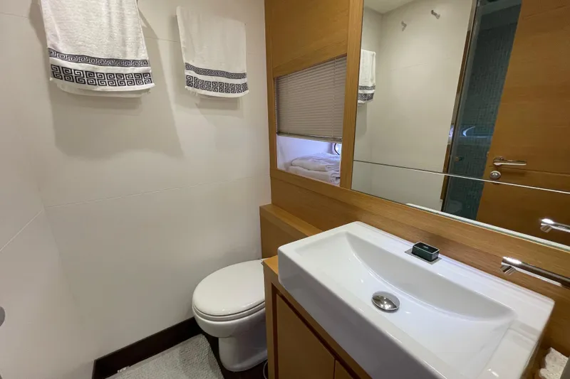  Yacht Photos Pics Bathroom interior of 2013 Pershing 62 yacht with modern sink and towels.