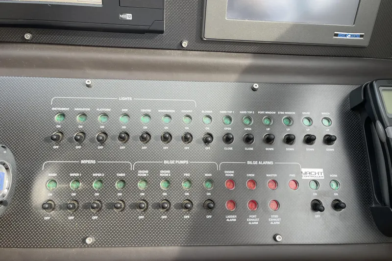  Yacht Photos Pics Control panel of a 2013 Pershing 62 yacht with switches and indicators.