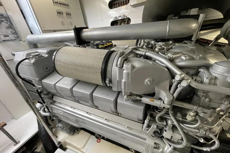  Yacht Photos Pics Engine room of a 2013 Pershing 62 yacht, showcasing detailed mechanical components.