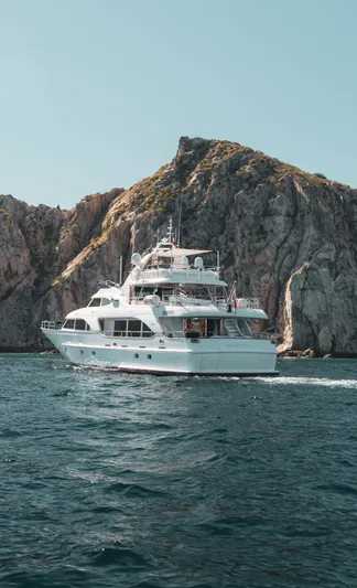 Marques Yacht Photos Pics 2008 Benetti Tradition 100 yacht cruising near rocky coastline.