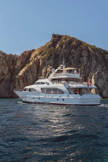 Marques Yacht Photos Pics 2008 Benetti Tradition 100 luxury yacht near rocky coastline.