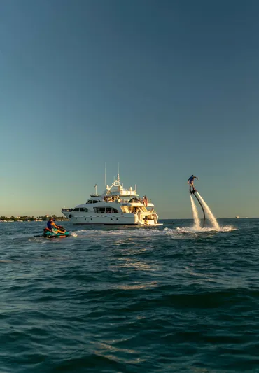 Marques Yacht Photos Pics 2008 Benetti Tradition 100 yacht with flyboarder in foreground.