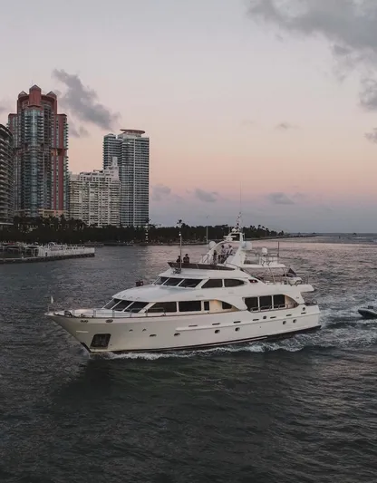 Marques Yacht Photos Pics 2008 Benetti Tradition 100 yacht cruising near city skyline.