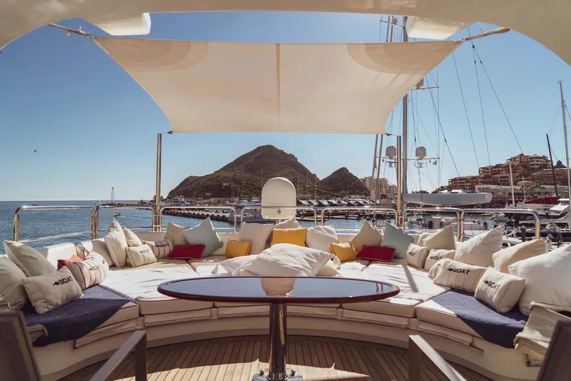 Marques Yacht Photos Pics Luxury Benetti Tradition 100 yacht, 2008 model, featuring stylish sun deck and cushions.