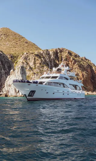 Marques Yacht Photos Pics 2008 Benetti Tradition 100 luxury yacht near rocky coastline.