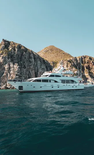 Marques Yacht Photos Pics 2008 Benetti Tradition 100 yacht cruising near rocky coastline.