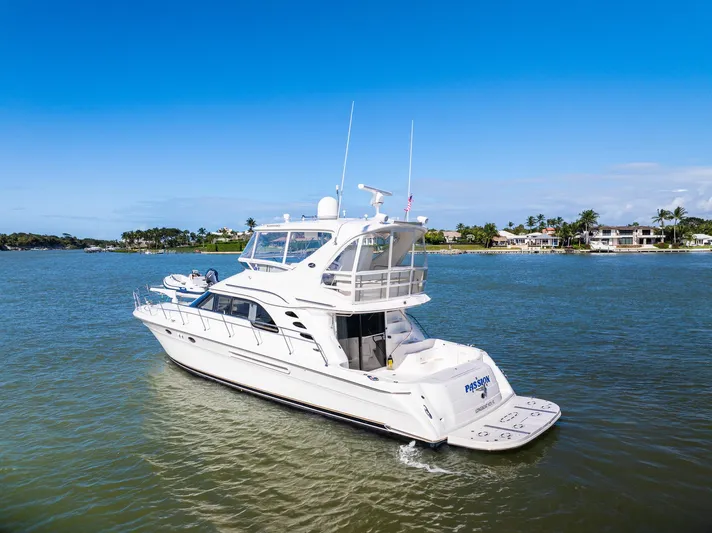  Yacht Photos Pics 2003 Sea Ray 560 Sedan Bridge yacht cruising on a sunny day.