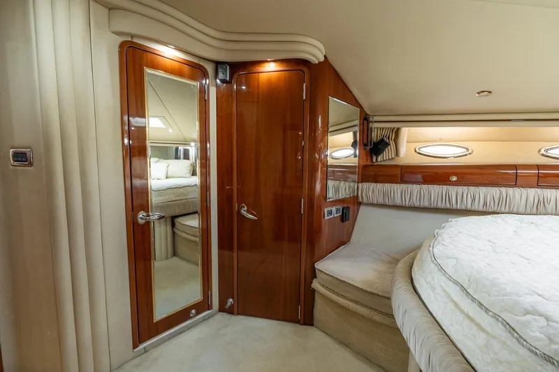  Yacht Photos Pics Luxurious interior of 2003 Sea Ray 560 Sedan Bridge yacht cabin with wood accents.