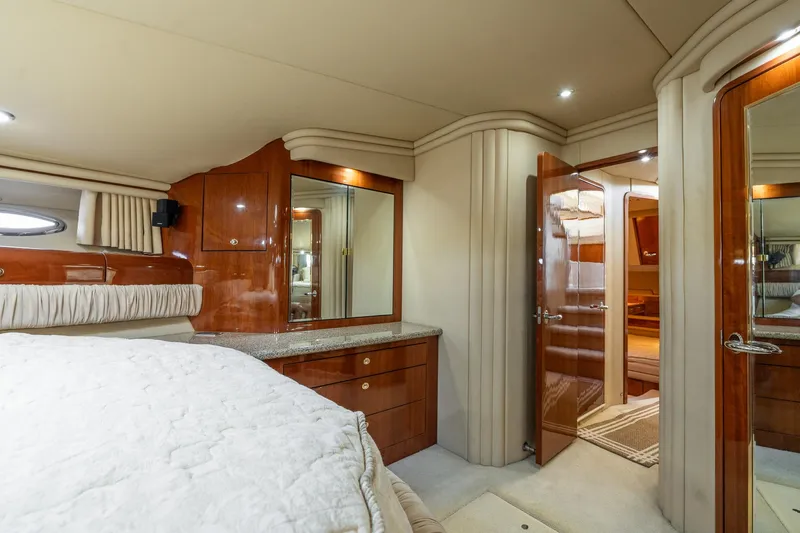  Yacht Photos Pics Luxurious 2003 Sea Ray 560 Sedan Bridge yacht interior with elegant wood finishes.