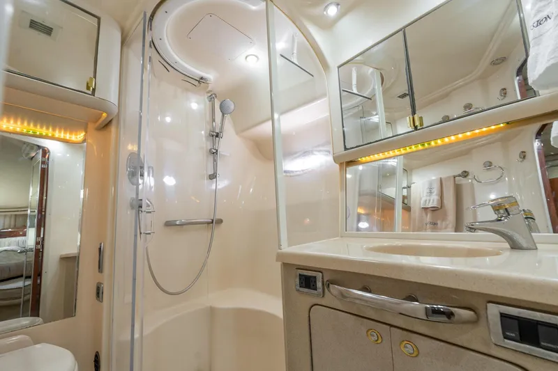  Yacht Photos Pics Luxurious bathroom in 2003 Sea Ray 560 Sedan Bridge yacht with modern shower and vanity.