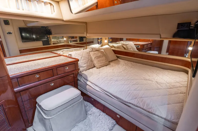  Yacht Photos Pics Luxurious bedroom interior of 2003 Sea Ray 560 Sedan Bridge yacht.