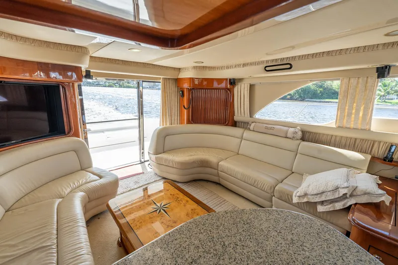 Yacht Photos Pics Luxurious interior of 2003 Sea Ray 560 Sedan Bridge yacht with plush seating.