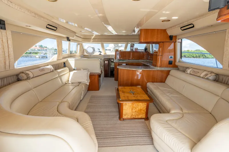 Yacht Photos Pics Luxurious interior of 2003 Sea Ray 560 Sedan Bridge yacht with elegant seating and wood finishes.