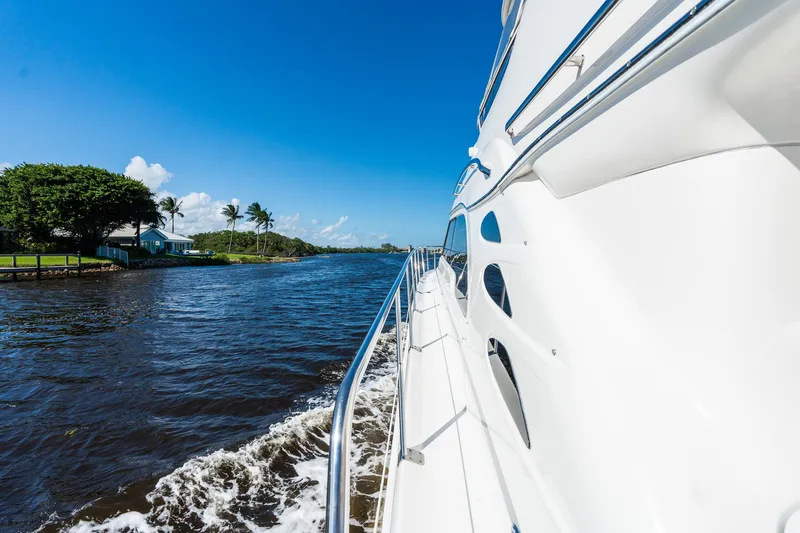  Yacht Photos Pics 2003 Sea Ray 560 Sedan Bridge cruising on a sunny day.