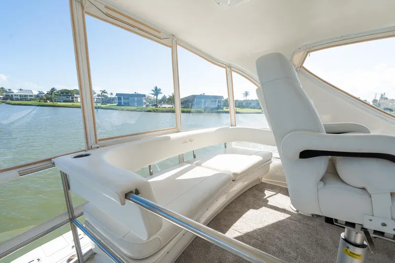  Yacht Photos Pics Luxurious interior of 2003 Sea Ray 560 Sedan Bridge yacht with panoramic water views.