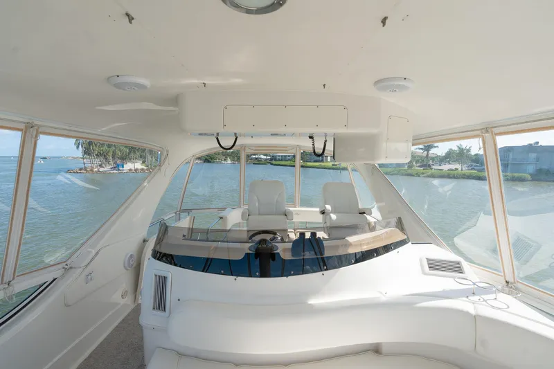  Yacht Photos Pics Interior view of 2003 Sea Ray 560 Sedan Bridge yacht helm station.