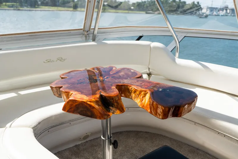  Yacht Photos Pics Luxurious 2003 Sea Ray 560 Sedan Bridge with unique wooden table on deck.