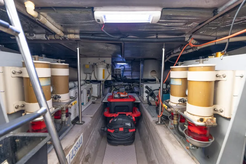  Yacht Photos Pics Engine room of 2003 Sea Ray 560 Sedan Bridge yacht, showcasing mechanical components.