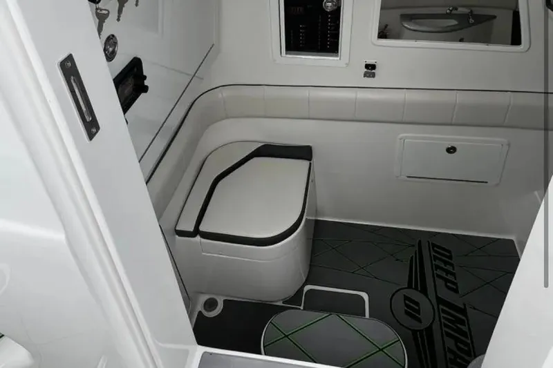  Yacht Photos Pics 2024 Deep Impact 399 Sport boat interior with modern seating and sleek design.