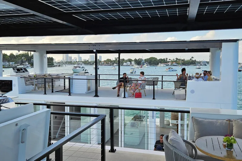 The Myth Yacht Photos Pics Modern ARKHAUS Villa 50 (2025) with rooftop seating, overlooking scenic waterfront and boats.