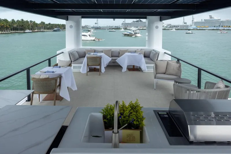 The Myth Yacht Photos Pics Luxurious ARKHAUS Villa 50 rooftop dining area overlooking serene waterfront, 2025 model.