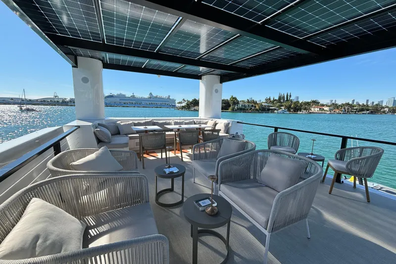 The Myth Yacht Photos Pics Luxurious ARKHAUS Villa 50 yacht deck with modern seating, solar panels, and ocean view, 2025 model.