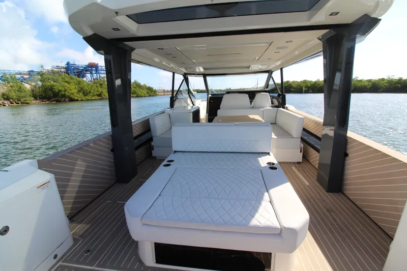  Yacht Photos Pics 2025 Saxdor 400 GTS luxury boat interior with modern seating and scenic water view.