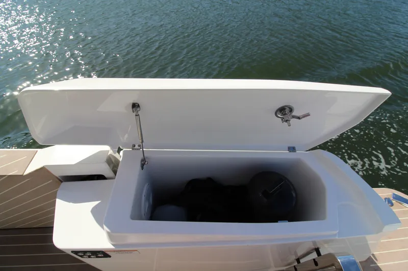  Yacht Photos Pics Open storage compartment on 2025 Saxdor 400 GTS boat, with water in the background.