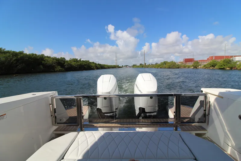  Yacht Photos Pics 2025 Saxdor 400 GTS boat with dual engines cruising on a scenic waterway.