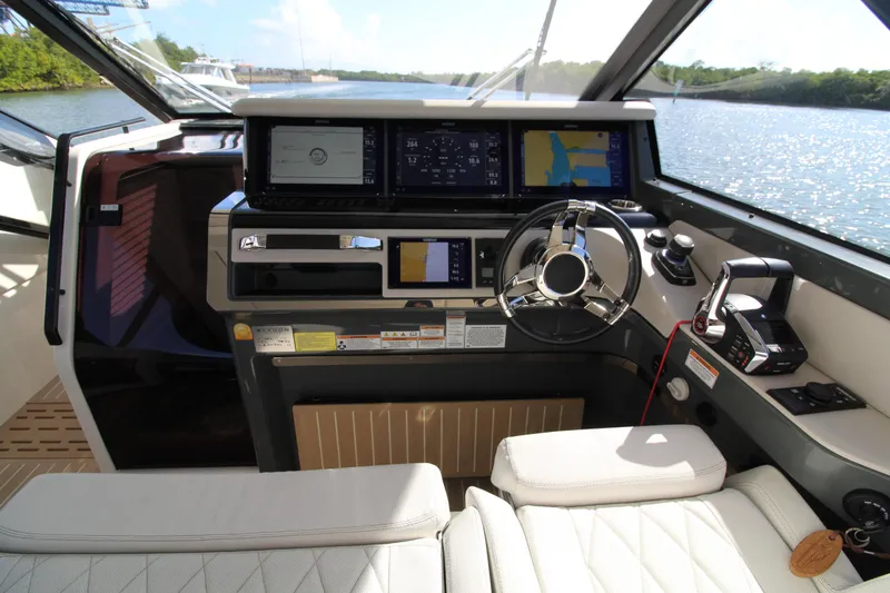  Yacht Photos Pics Cockpit of 2025 Saxdor 400 GTS boat with modern navigation equipment and steering wheel.