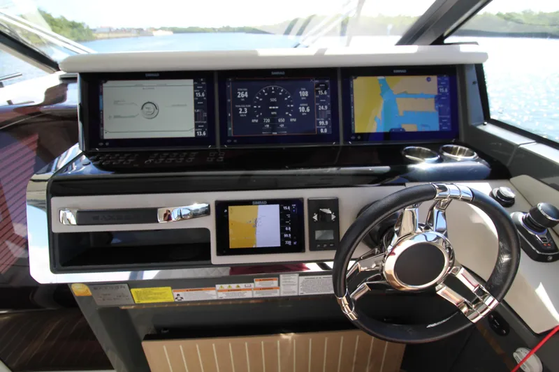  Yacht Photos Pics Helm of 2025 Saxdor 400 GTS with advanced navigation displays and steering wheel.