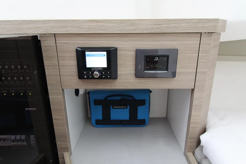  Yacht Photos Pics Control panel and storage area inside 2025 Saxdor 400 GTS boat cabin.