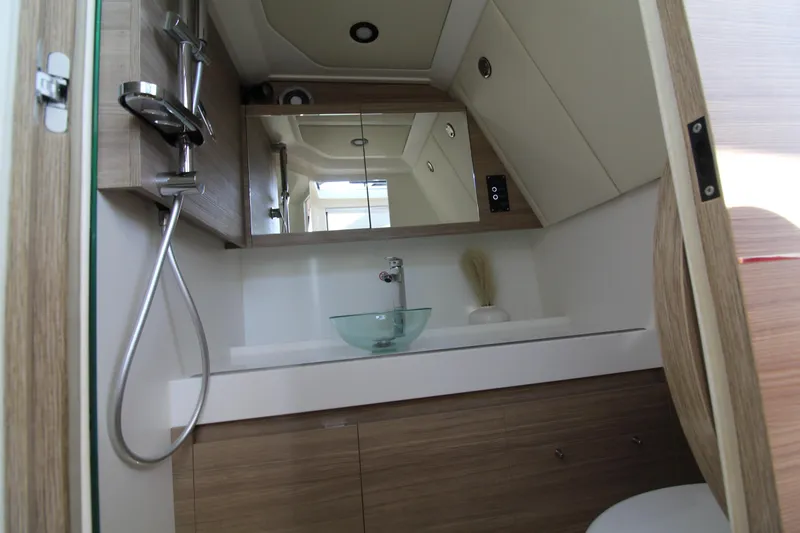  Yacht Photos Pics Modern bathroom interior of 2025 Saxdor 400 GTS yacht with sleek fixtures and glass sink.