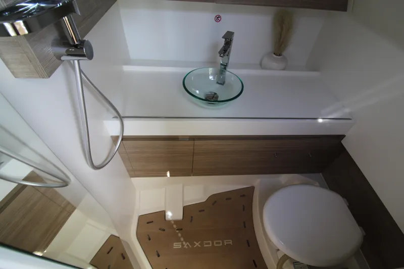  Yacht Photos Pics Modern bathroom interior of 2025 Saxdor 400 GTS boat, featuring sleek fixtures and minimalist design.