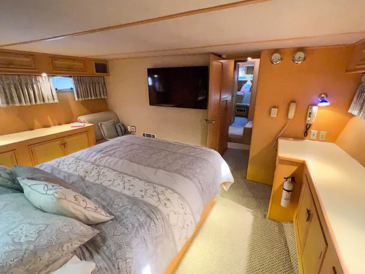 Audacious Yacht Photos Pics Luxurious bedroom interior of 1986 Southern Cross 53 yacht with modern amenities.