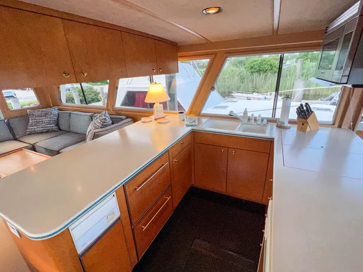 Audacious Yacht Photos Pics Spacious kitchen interior of 1986 Southern Cross 53 yacht with modern amenities and large windows.