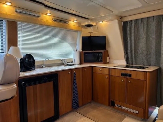  Yacht Photos Pics Interior of 2004 Meridian Sedan Bridge 341 yacht with modern kitchen amenities.