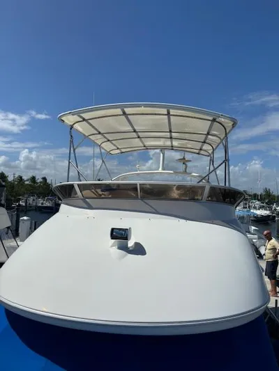  Yacht Photos Pics 2004 Meridian Sedan Bridge 341 yacht docked under clear blue sky.