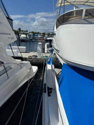  Yacht Photos Pics 2004 Meridian Sedan Bridge 341 docked at marina, sunny day.