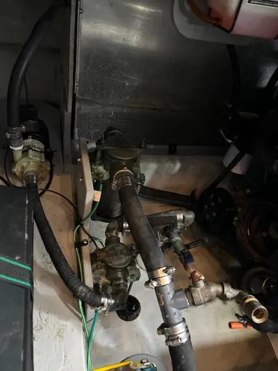  Yacht Photos Pics Engine compartment of 2004 Meridian Sedan Bridge 341 with visible hoses and components.